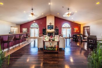 Recreation center with seating and kitchen